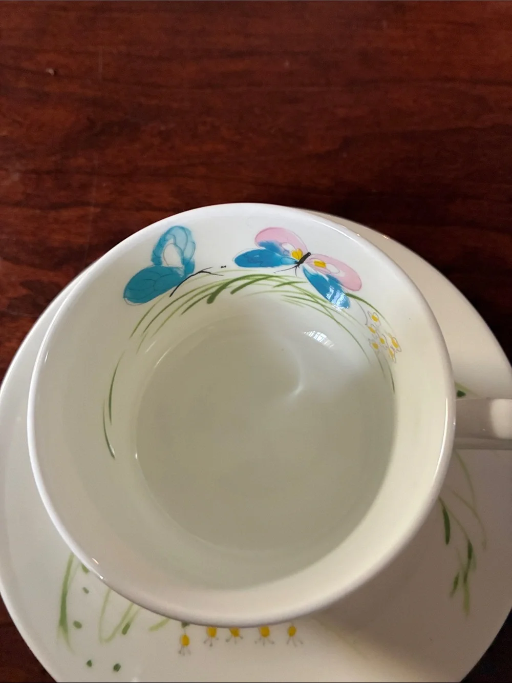 Mikasa White Cup and Saucer with Orange Butterfly and Blue Floral Accents
